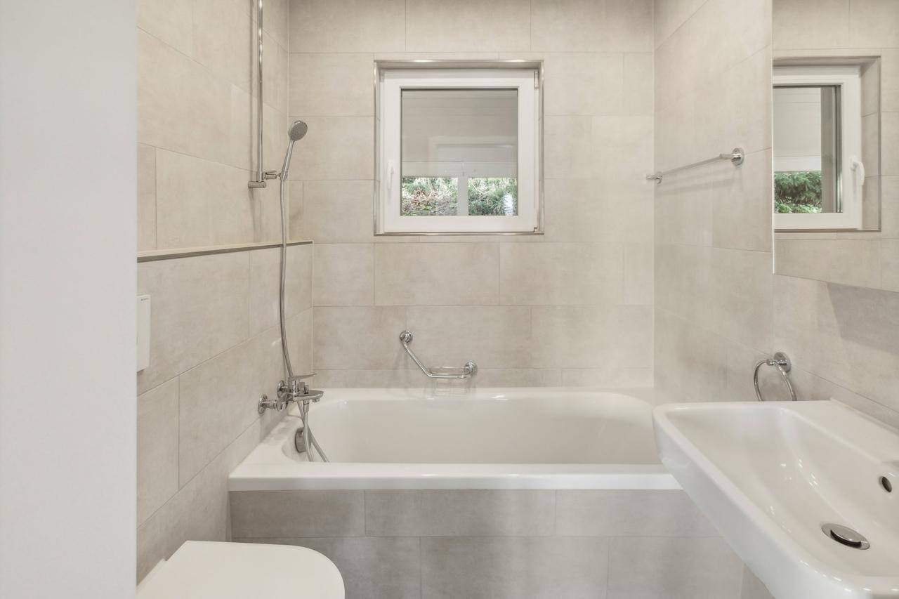 Renovated bathroom with bathtub
