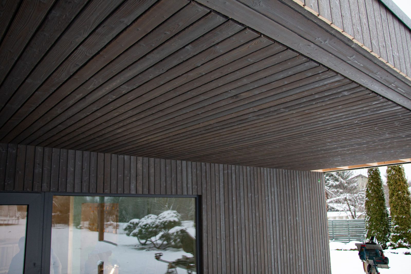 Light grey charred spruce soffit and facade